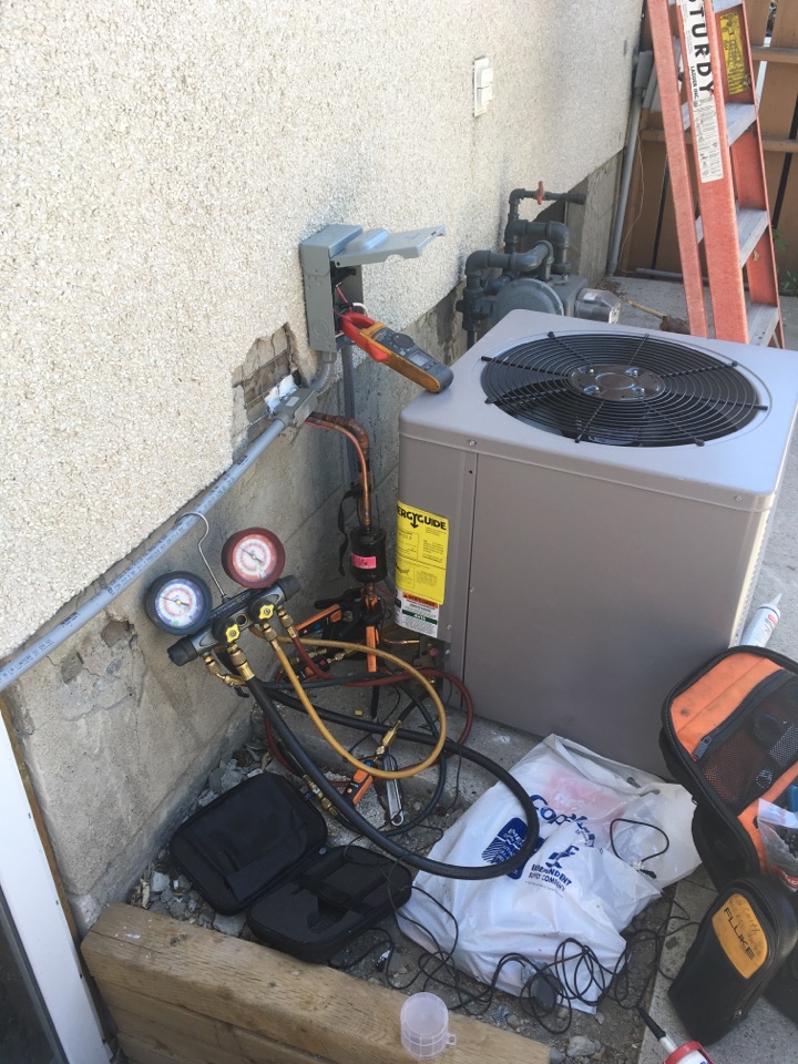 Thorncliffe, AB - Installing 2.4 ton condenser  Thorncliffe, AB - Installing 2.4 ton condenser